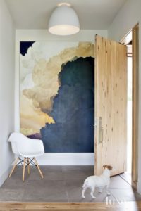 Blue oversized art with white chair